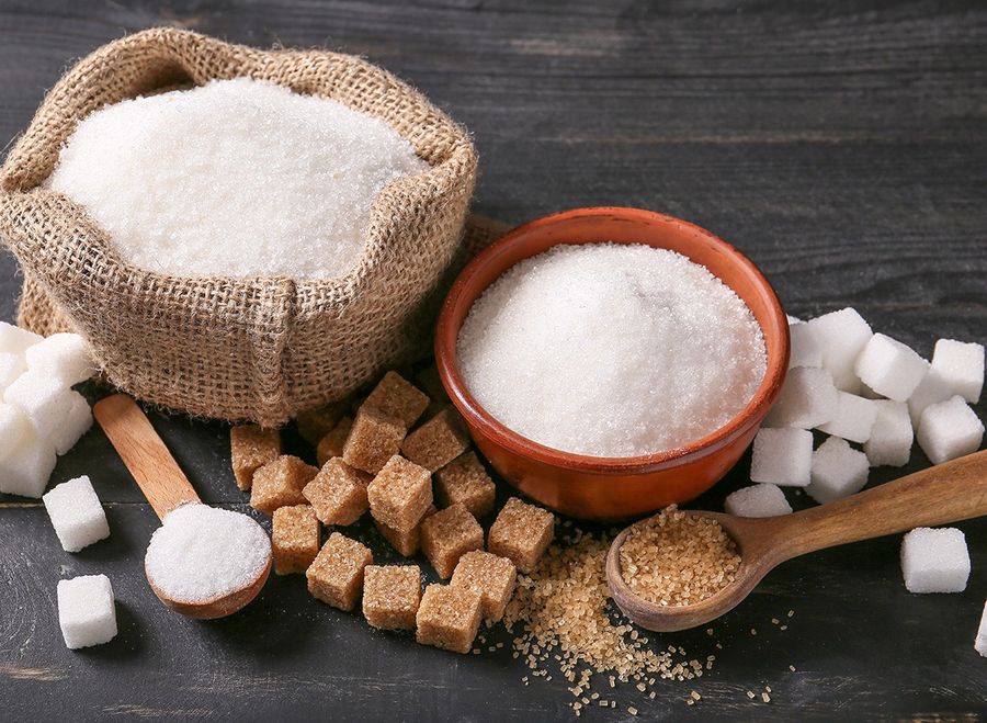 Different sugar on dark table