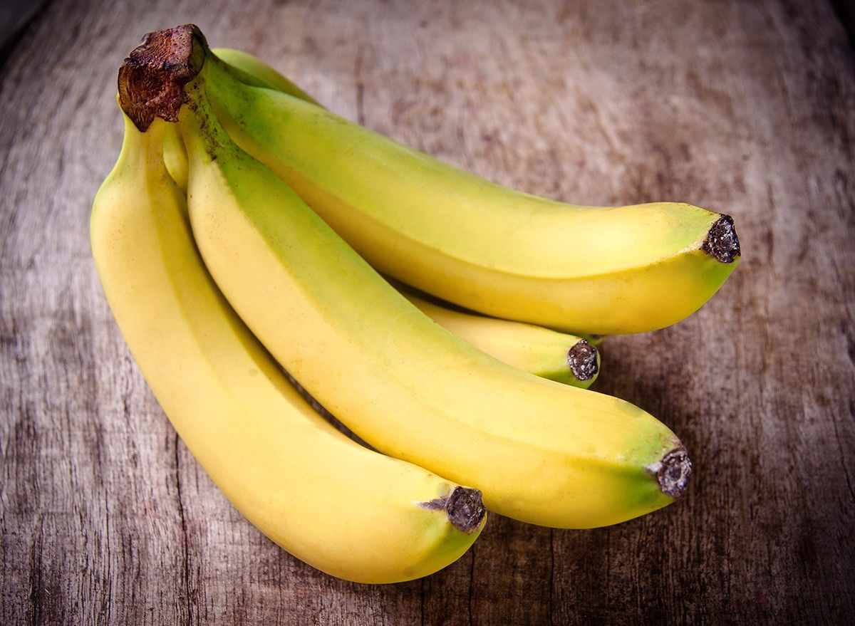 Fresh bananas on wooden background