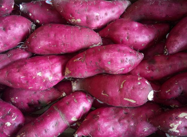 Japanese sweet potato is healthy food heap in brown paper box.