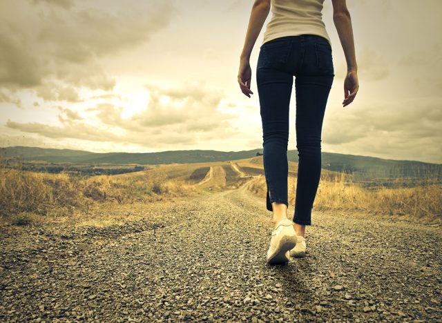 woman walking towards unknown places