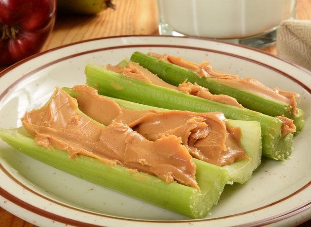 Crispy celery sticks with organic peanut butter and milk