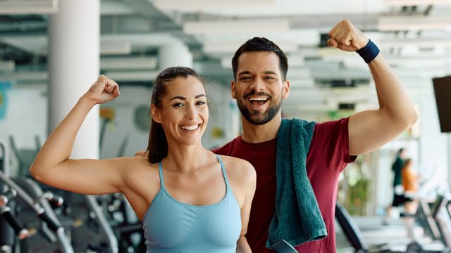 Happy,Athletic,Couple,Flexing,Muscles,Working,Out,gym,exercise,health,fitness