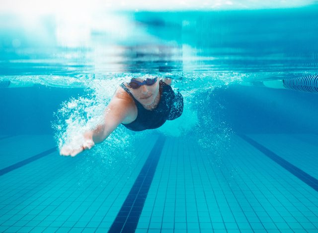 Competitive swimmer racing in pool