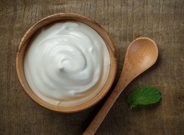 Greek yogurt on wooden background, Health food from yogurt concept