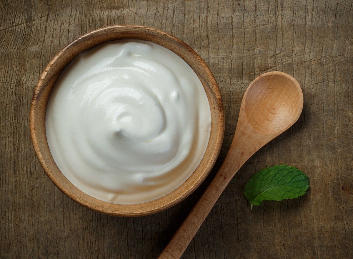 Greek yogurt on wooden background, Health food from yogurt concept