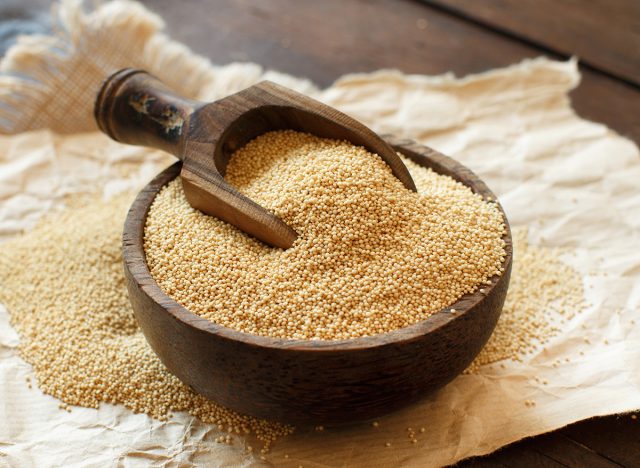 Raw Organic Amaranth grain in a bowl on wooden table