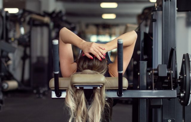 Blonde young woman give up workout in gym, fail.