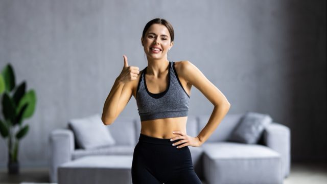 Photo of happy good mood beautiful charming athlete sportive girl taking selfie at home showing thumb up.