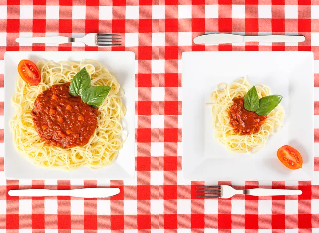 Contrasting large and tiny food portions of Spaghetti