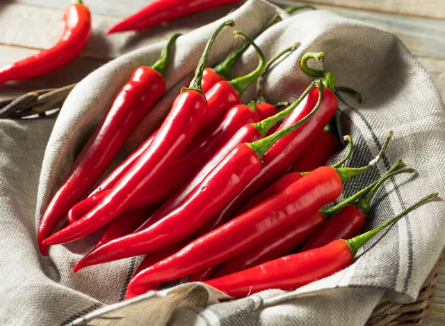 Raw Red Organic Hot Finger Peppers in a Basket