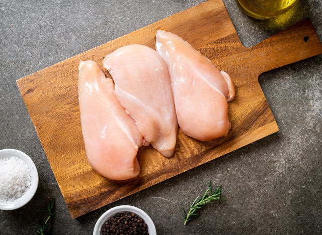 fresh chicken breast raw on cutting board