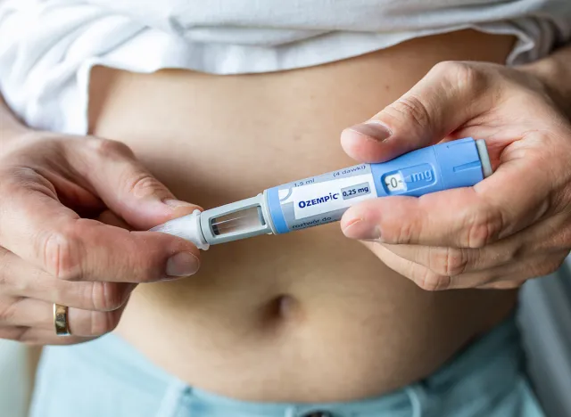 GDANSK, POLAND - MAY 2022: obese fat man preparing Semaglutide Ozempic injection control blood sugar levels