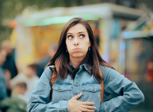 Woman,Feeling,Hungry,Looking,For,Something,To,Eat,In,Amusement