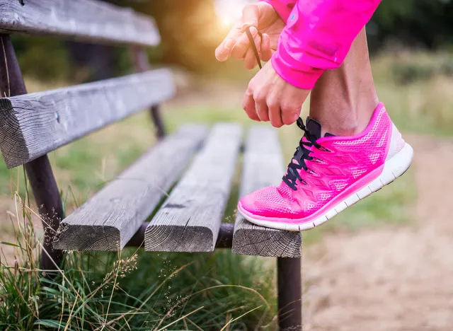 Young sportive woman getting ready to start running workout - Athlete running outdoors at sunset - Attractive girl making sport to lose weight and stay fit