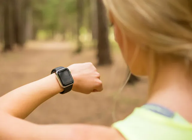 Active woman using smartwatch