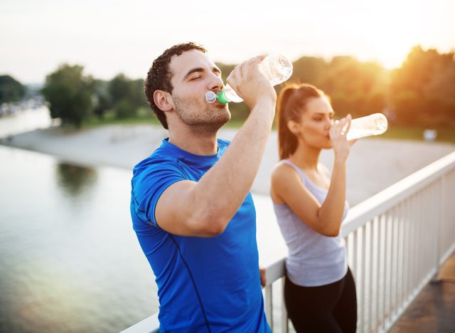 Couple staying hydrated after workout