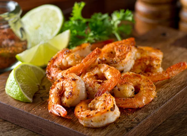 Delicious sauteed shrimp with cajun seasoning and lime on a maple plank.