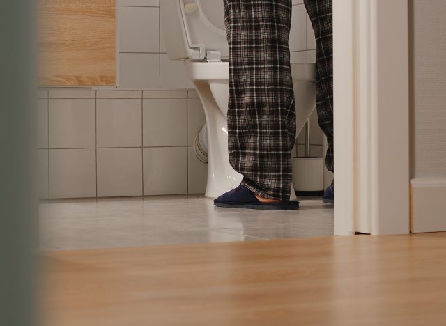 Adult man in a toilet at home