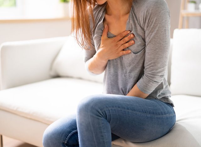 Portrait Of A Young Woman Suffering From Chest Pain