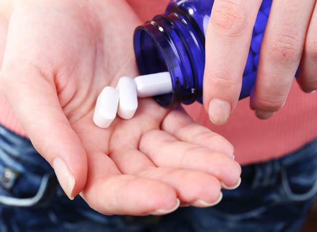 Pills in hand, close-up