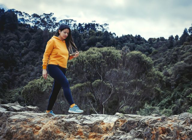 Young woman walking on the mountain