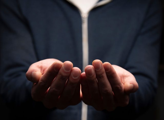 businessman in suit making gesture