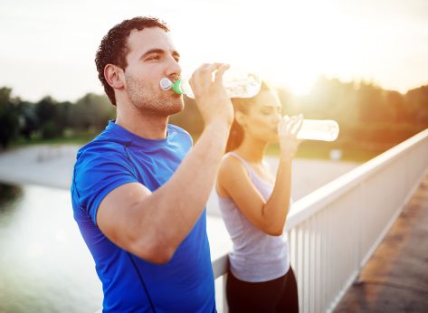 Couple staying hydrated after workout