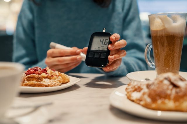 Diabetic woman measuring normal sugar level