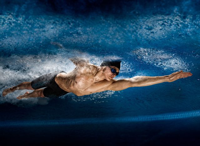 Professional man in swimming pool. View underwater