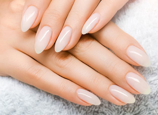 Manicure and Hands Spa. Beautiful Woman hand closeup. Manicured nails and Soft hands skin wide banner. Beauty treatment. Beautiful woman's nails with beautiful baby boomer manicure copy space for