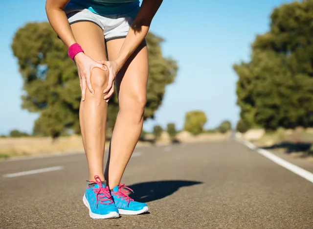 Female runner knee injury and pain.