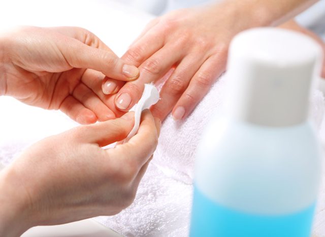 Nail polish remover, beauty salon, manicure.Treatment hand and nail care, the woman to a beautician for a manicure.