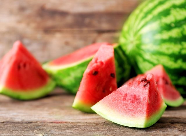 Fresh sliced watermelon wooden background