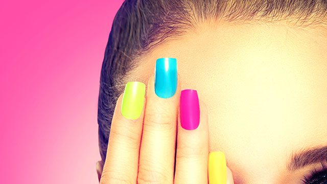 Beauty,Girl,Face,With,Colorful,Nail,Polish.,Colourful,Studio,Shot
