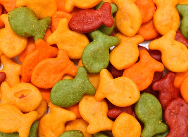 A scaterring of colorfull goldfish crackers. on white background