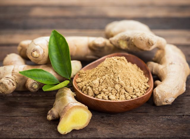 Ginger root and ginger powder in the bowl