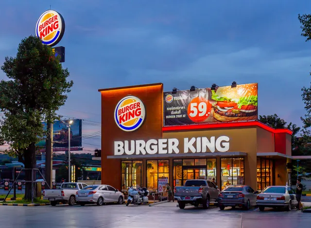 Saraburi, Thailand - JUNE 3, 2018 - Burger King modern restaurant at PTT gasoline fuel station sunset sky
