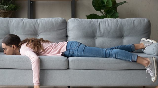 Lazy,Unmotivated,Of,Girl,Lying,Rest,At,Home,In,Living
