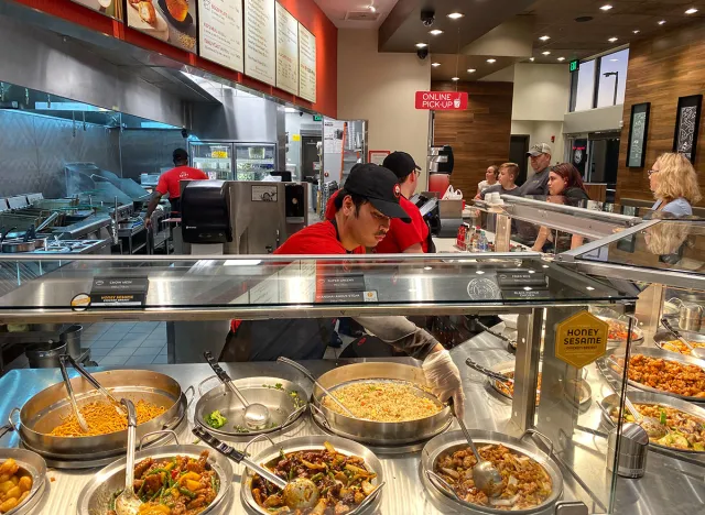 Orlando,FL/USA-10/2/19: Panda Express chinese fast food restaurant employees waiting on customers.