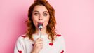 Close-up portrait of her she nice attractive pretty cute glad cheerful cheery wavy-haired girl licking spoon celebratory festal lunch homemade breakfast isolated on pink pastel color background