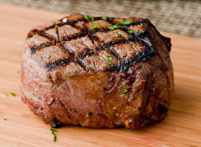 Filet mignon. Grade A grass fed angus beef steak. Tenderloin, filet mignon, New York strip, bone in rib-eye grilled medium rare on outdoor grill. Classic American steakhouse entree favorite.