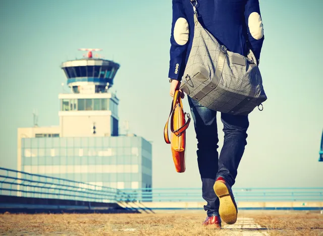 Handsome businessman is walking at the airport