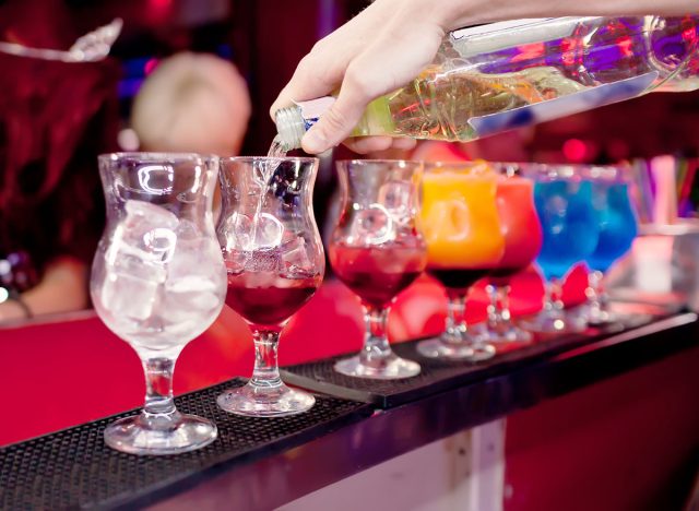 Barman prepares exotic cocktails at the night club