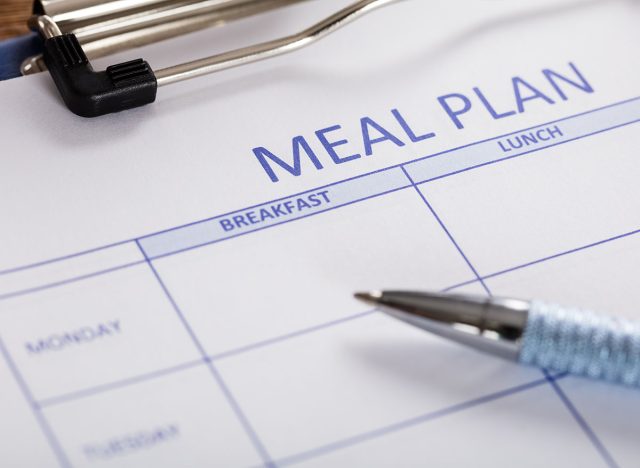 Close-up Of Pen With Meal Plan Form