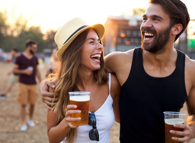 Young and cheerful couple in music festival.