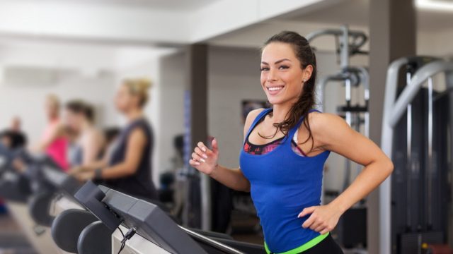 Woman running on treadmill.