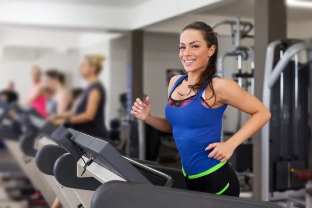 Woman running on treadmill.