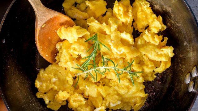 Morning Perfection: Intimate Close-up of Fluffy Scrambled Eggs in a white plate