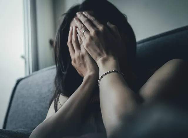 panic attacks young girl sad and fear stressful depressed emotional.crying use hands cover face begging help.stop abusing violence in women,person with health anxiety,people bad feeling down concept