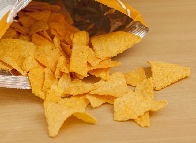 doritos on wooden table, copy space